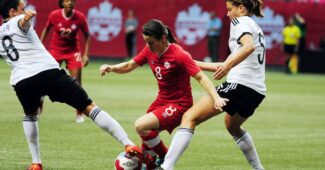Players battle for the ball in a soccer game
