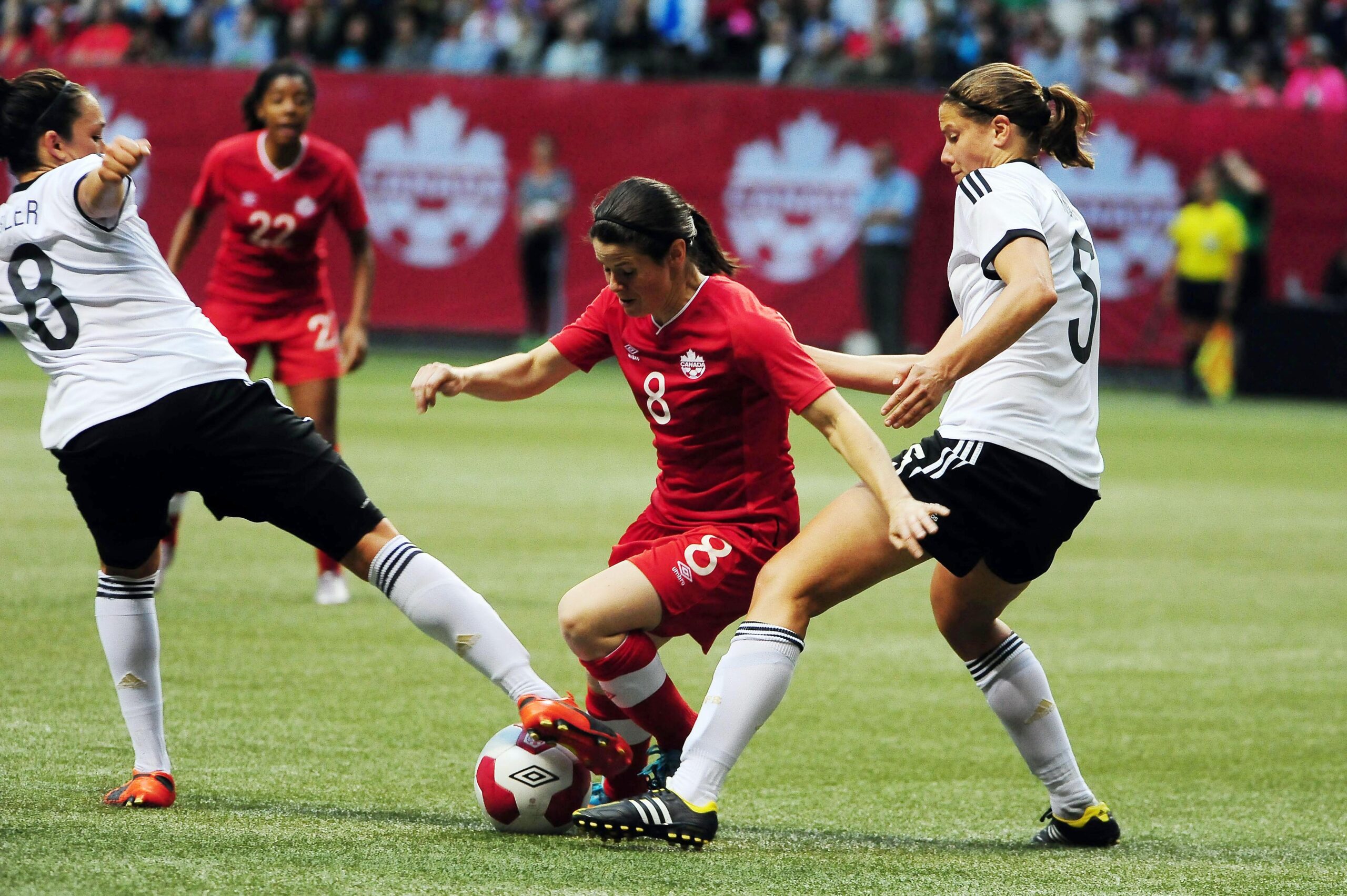 Players battle for the ball in a soccer game