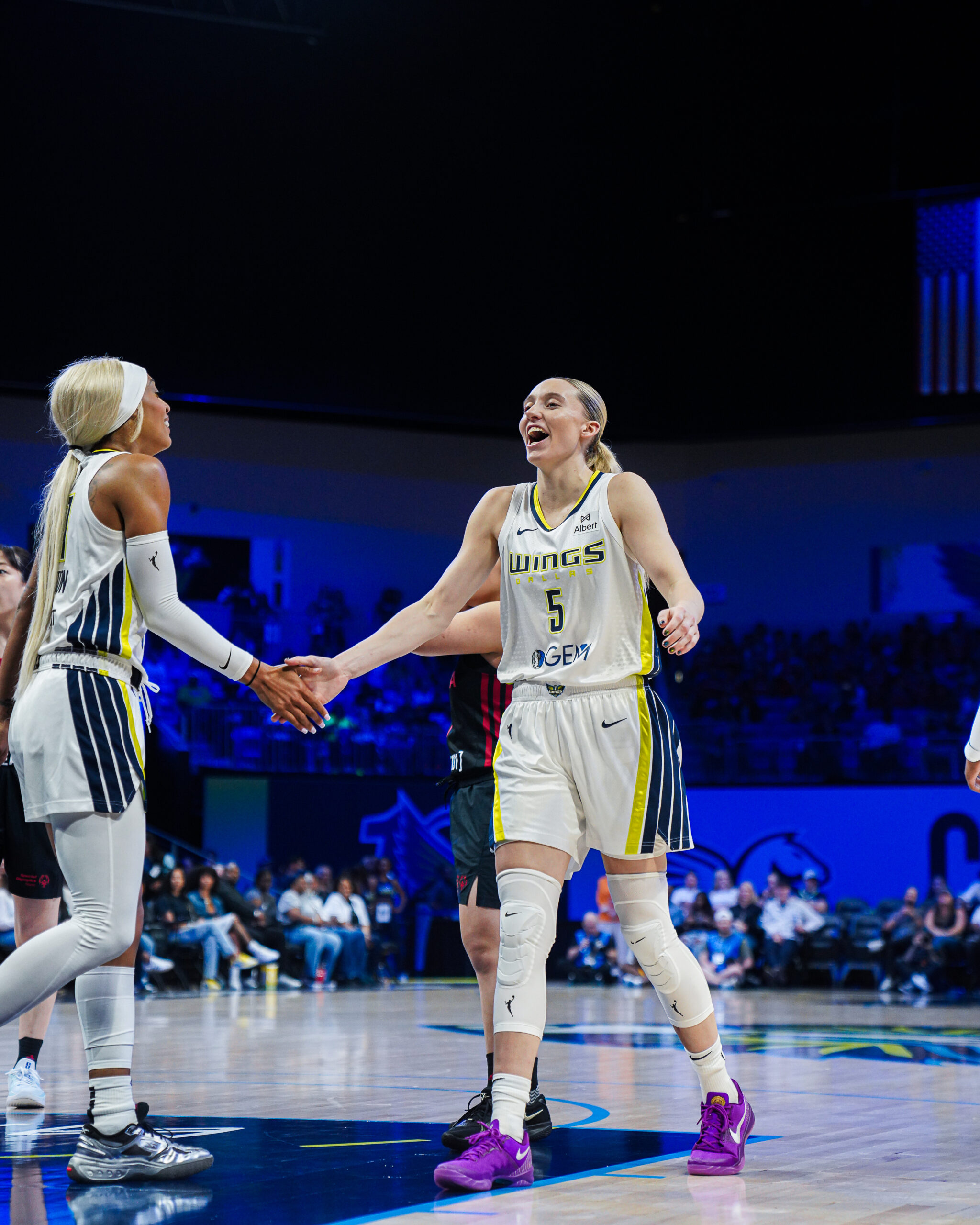 Paige Bueckers high-fives teammate DiJonai Carrington during a preseason exhibition game.