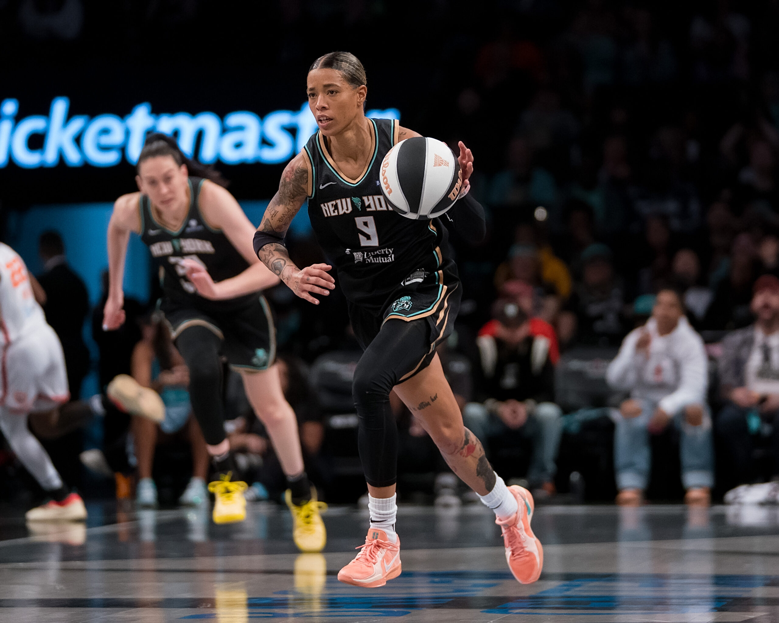 Natasha Cloud brings up the ball with Breanna Stewart trailing her.