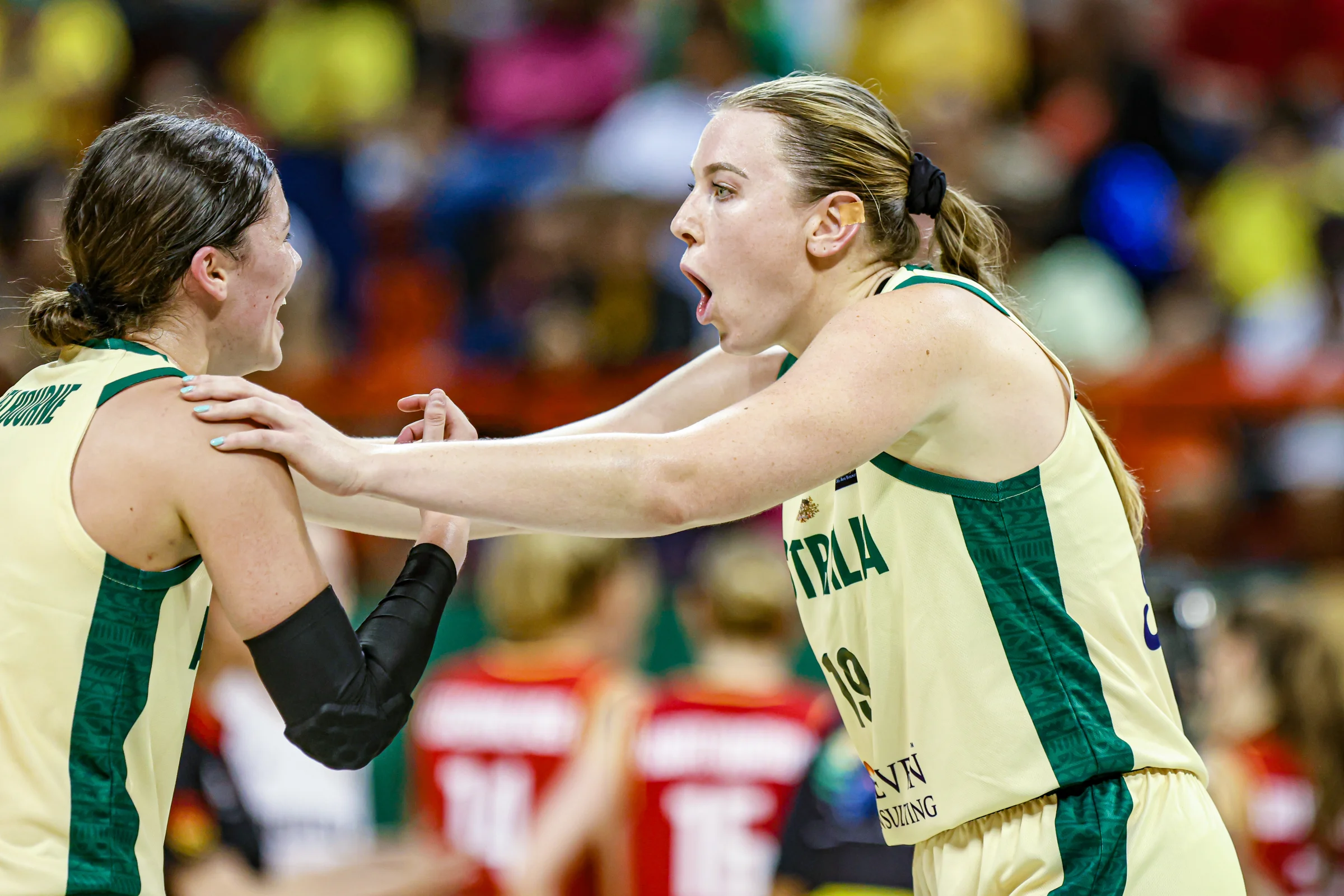 A shocked Sara Blicavs grabs Jade Melbourne's shoulders. They're playing for the Australian Opals at the OQT