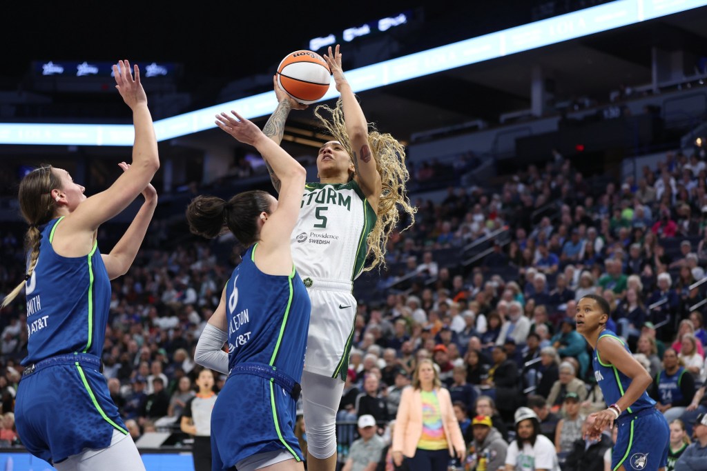 Seattle Storm forward Gabby Williams takes a contested shot against the Minnesota Lynx in a game on May 27, 2025 at Target Center in Minneapolis, Minnesota.