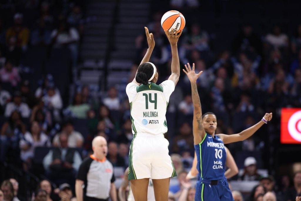 Seattle Storm rookie Dominique Malonga shoots over a Minnesota Lynx defender on May 27, 2025 at Target Center in Minneapolis, Minnesota.