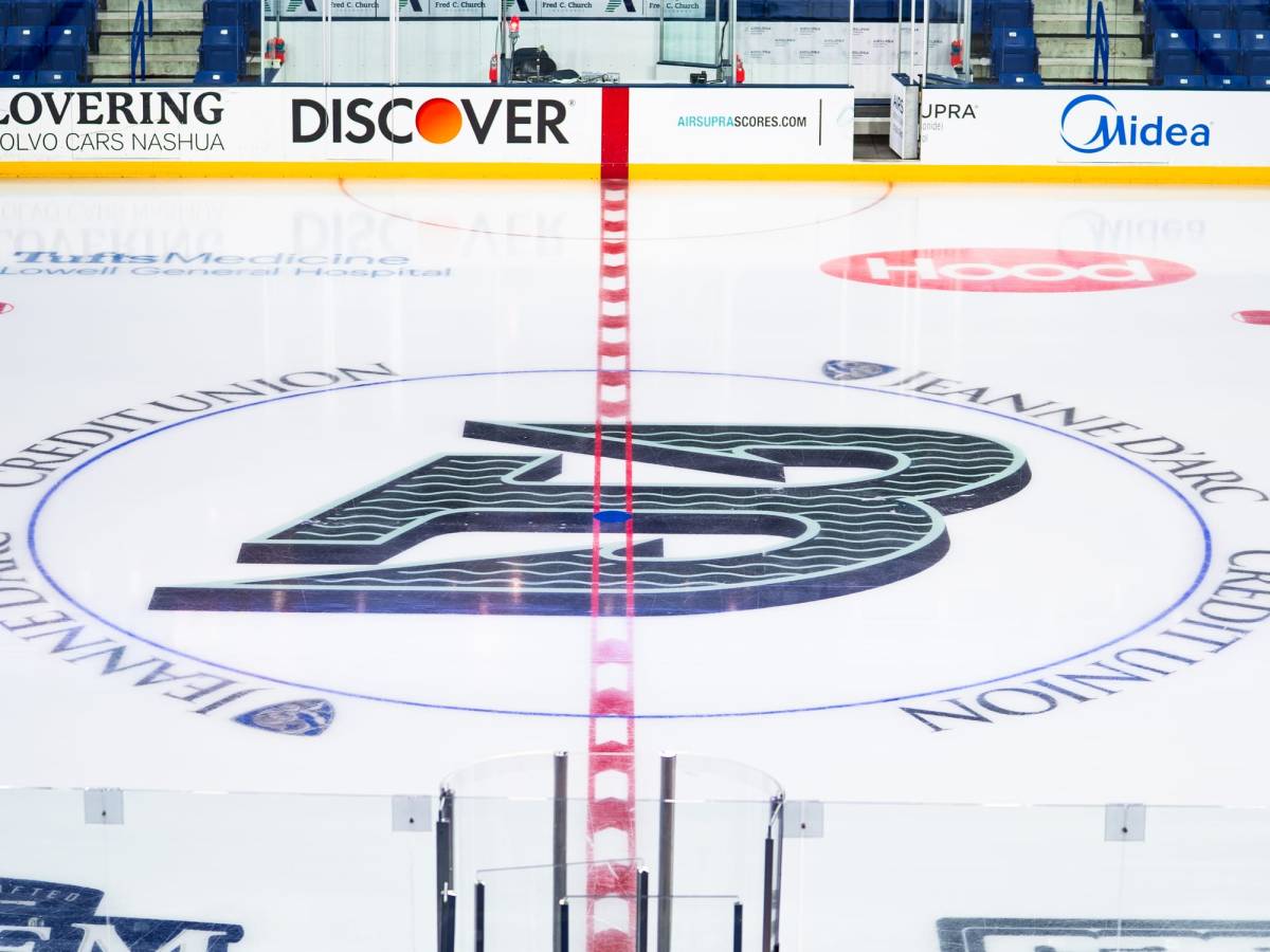 The Fleet's logo, a green B shaped like an anchor, straddles the red center ice line at the Tsongas Center.