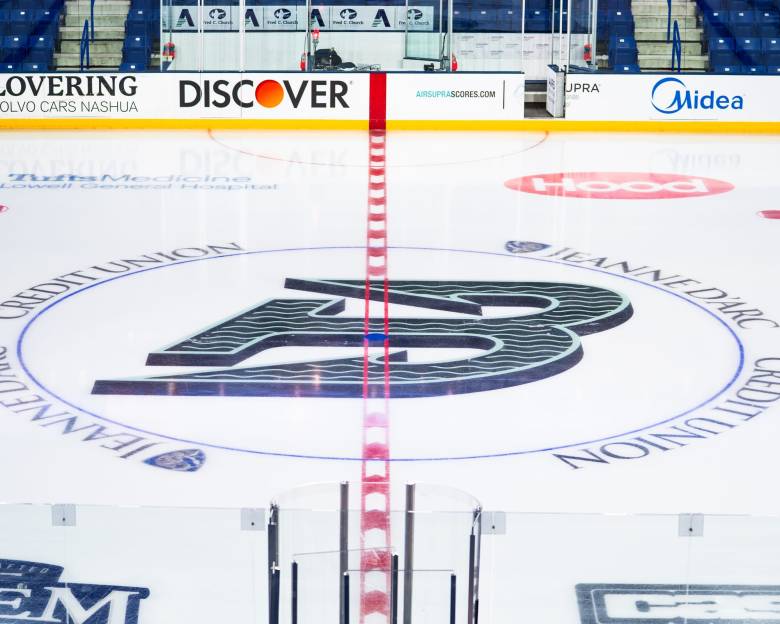 The Fleet's logo, a green B shaped like an anchor, straddles the red center ice line at the Tsongas Center.