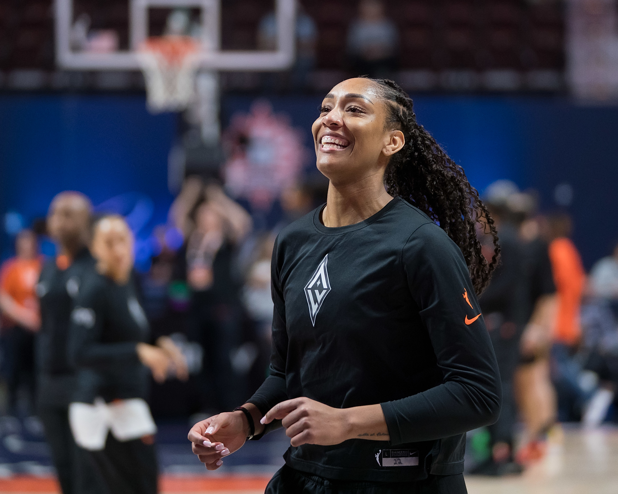 Before their matchup between the Connecticut Sun, Las Vegas Aces center A’ja Wilson smiles during her warmup routine.