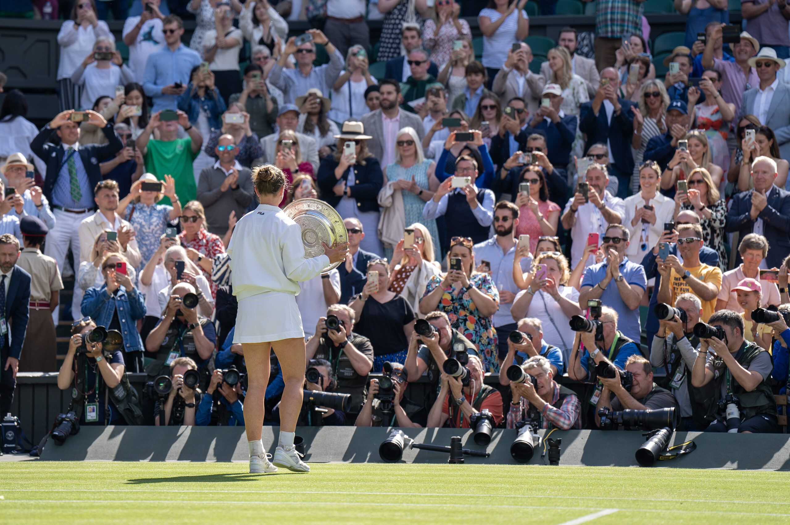 Barbora Krejcikova holds the 2024 Wimbledon trophy