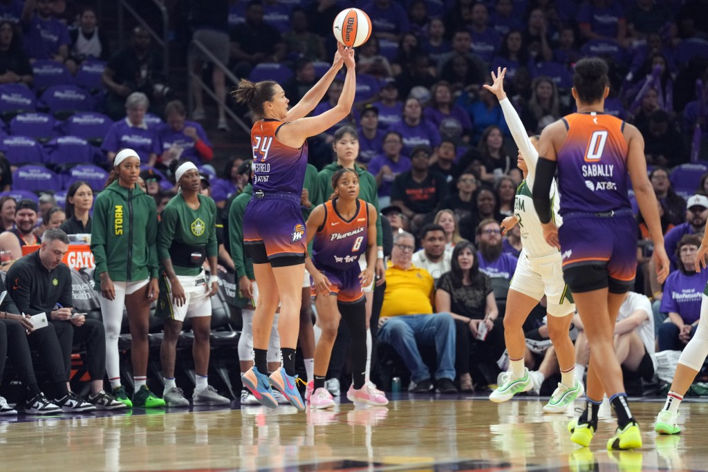 Kathryn Westbeld (24) shoots a 3-pointer 