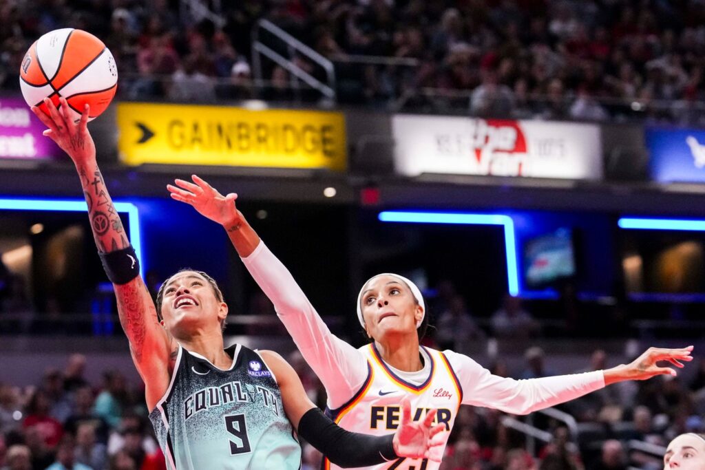 DeWanna Bonner attempts to block Natasha Cloud's shot.