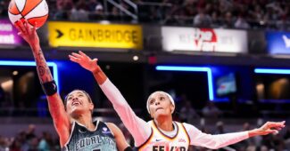 DeWanna Bonner attempts to block Natasha Cloud's shot.