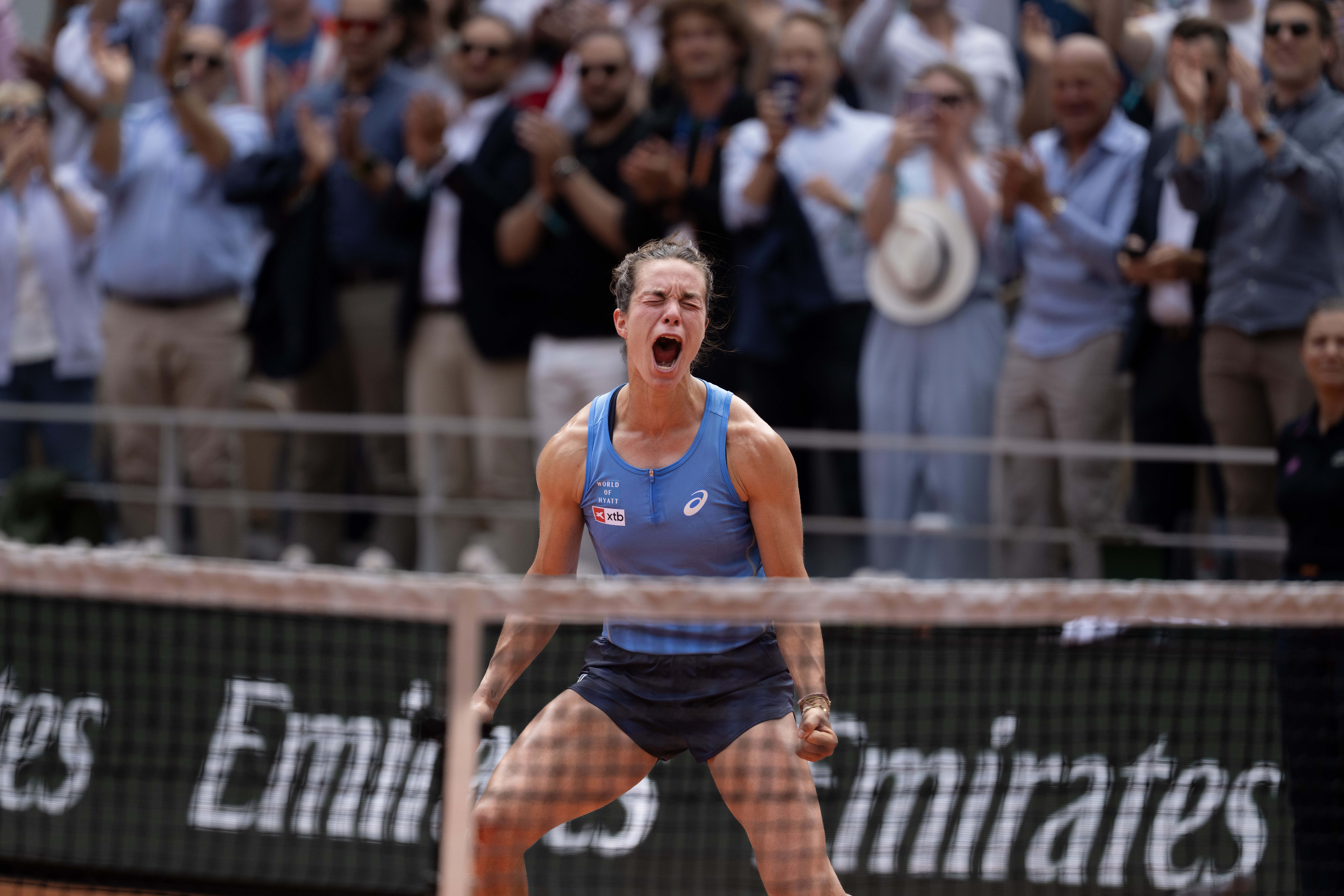 Lois Boisson reacts after defeating Jessica Pegula at Roland Garros