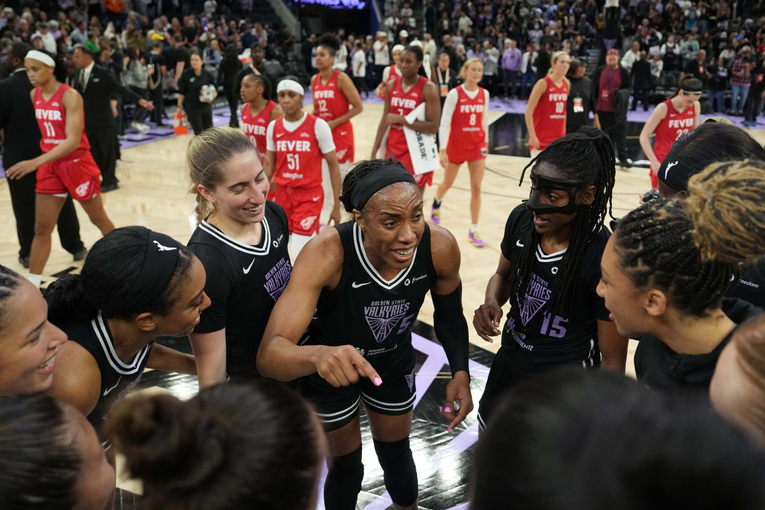 Golden State Valkyries forward Kayla Thornton (5) talks to teammates after defeating the Indiana Fever at Chase Center. Mandatory Credit: Darren Yamashita-Imagn Images