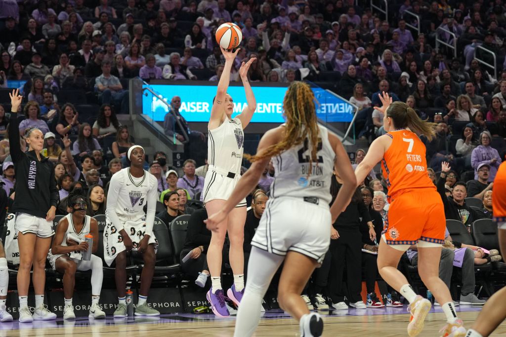 Golden State Valkyries forward Chloe Bibby shoots the ball. She is shown from the front, and a packed crowd is in the background behind her.