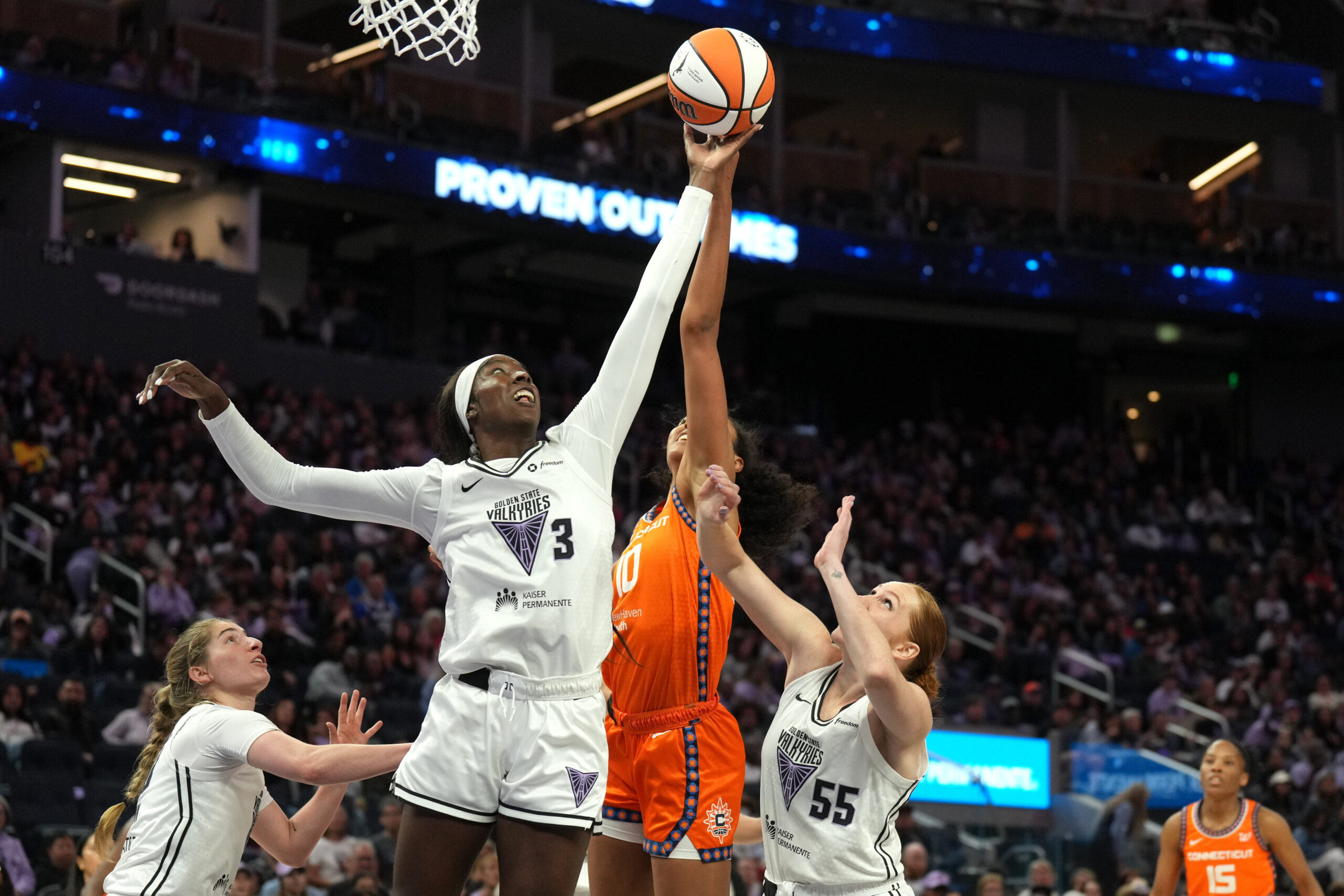 Valkyries forward Laeticia Amihere leaps and grabs for a rebound against the Connecticut Sun.