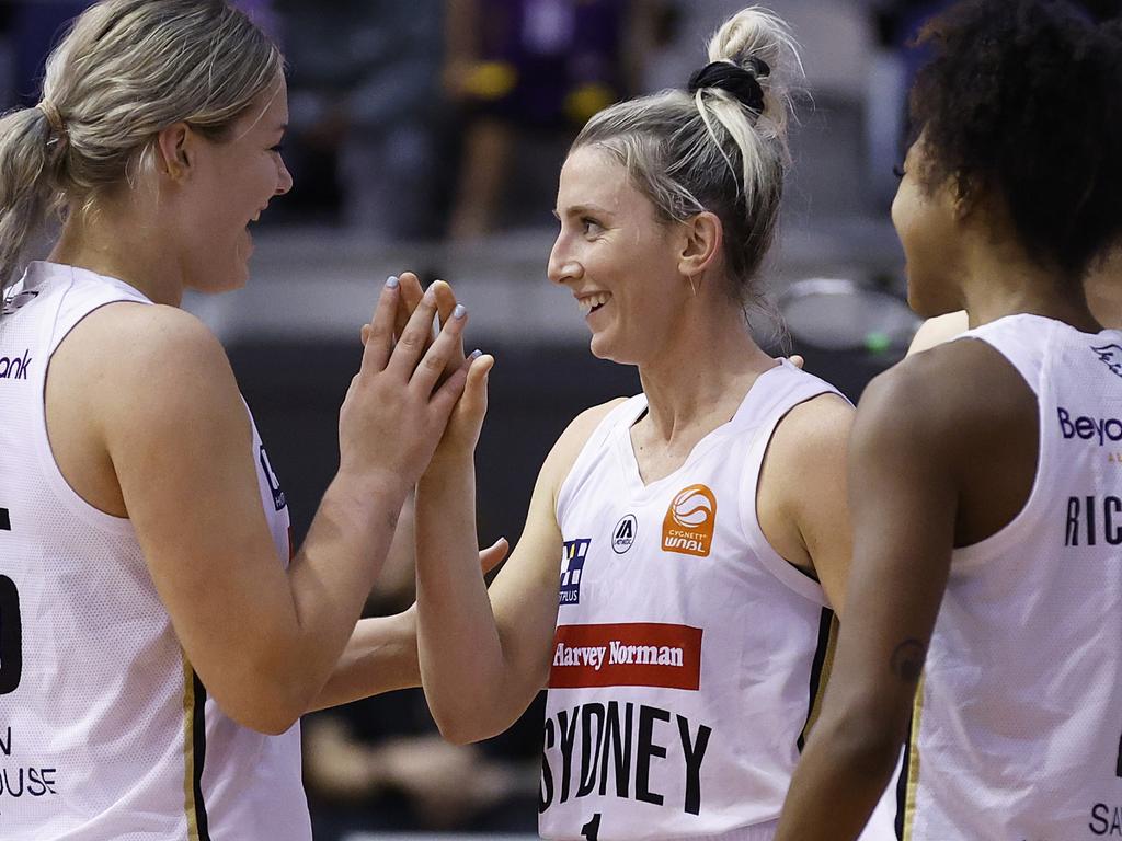 Lauren Nicholson celebrates with Sydney Flames teammates