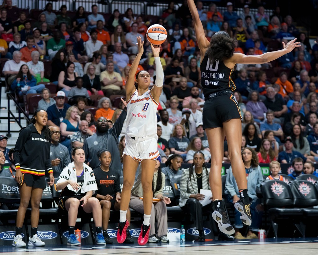 Phoenix Mercury forward Satou Sabally shoots a 3-pointer while Sun center <a rel=