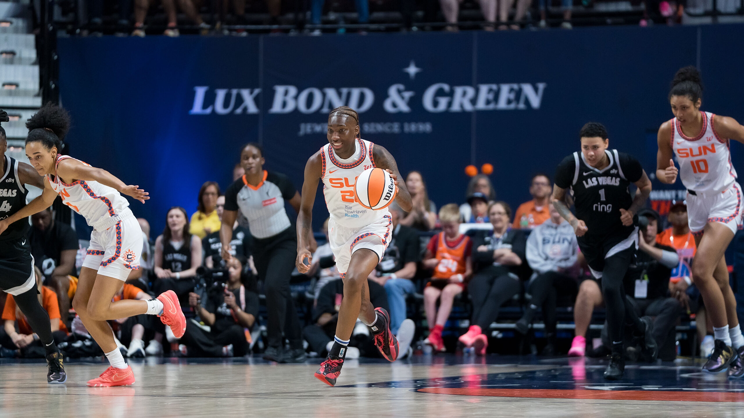 Connecticut Sun guard Saniya Rivers dribbles the ball while running up the court