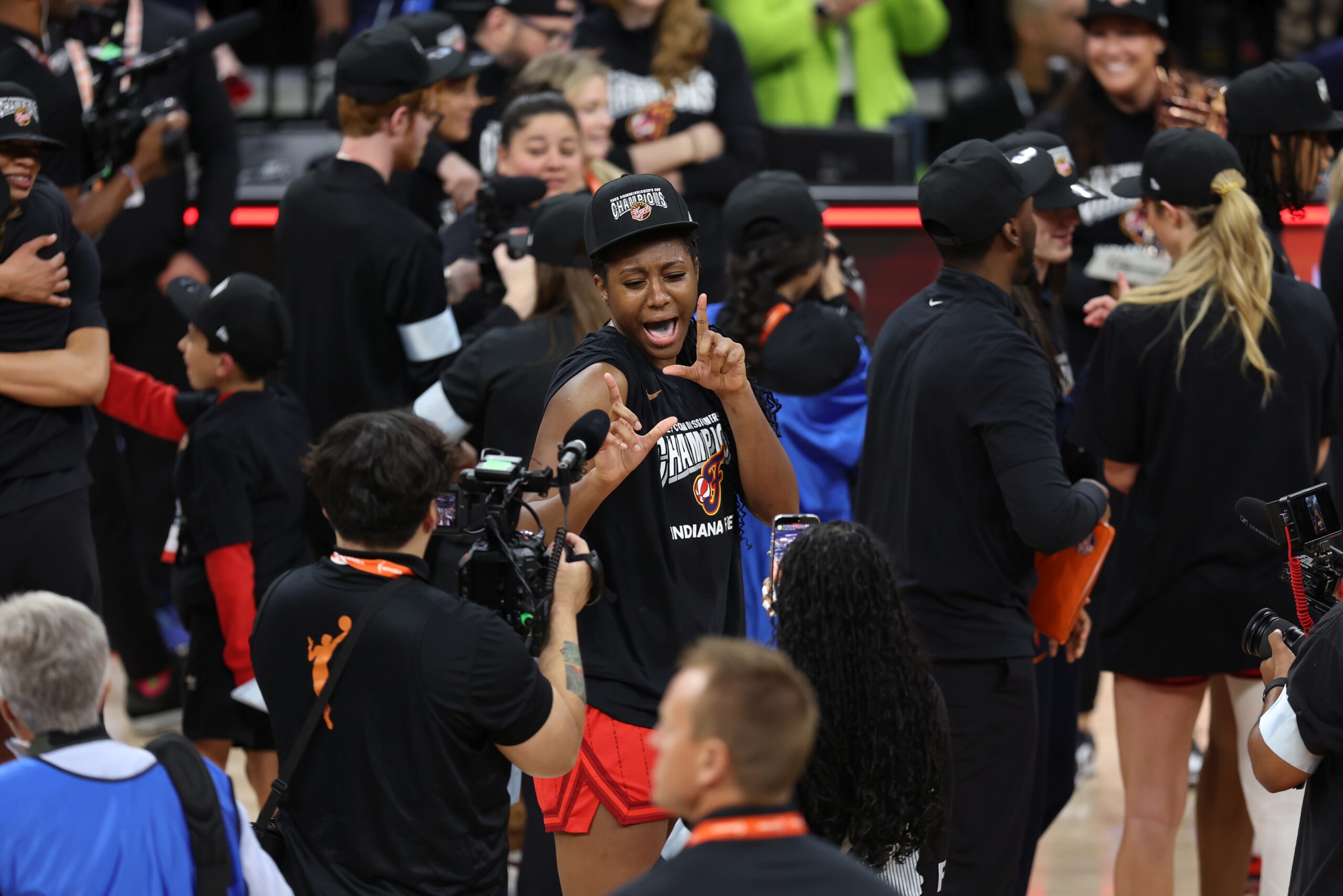 Indiana Fever center Aliyah Boston dances in celebration in front of a camera