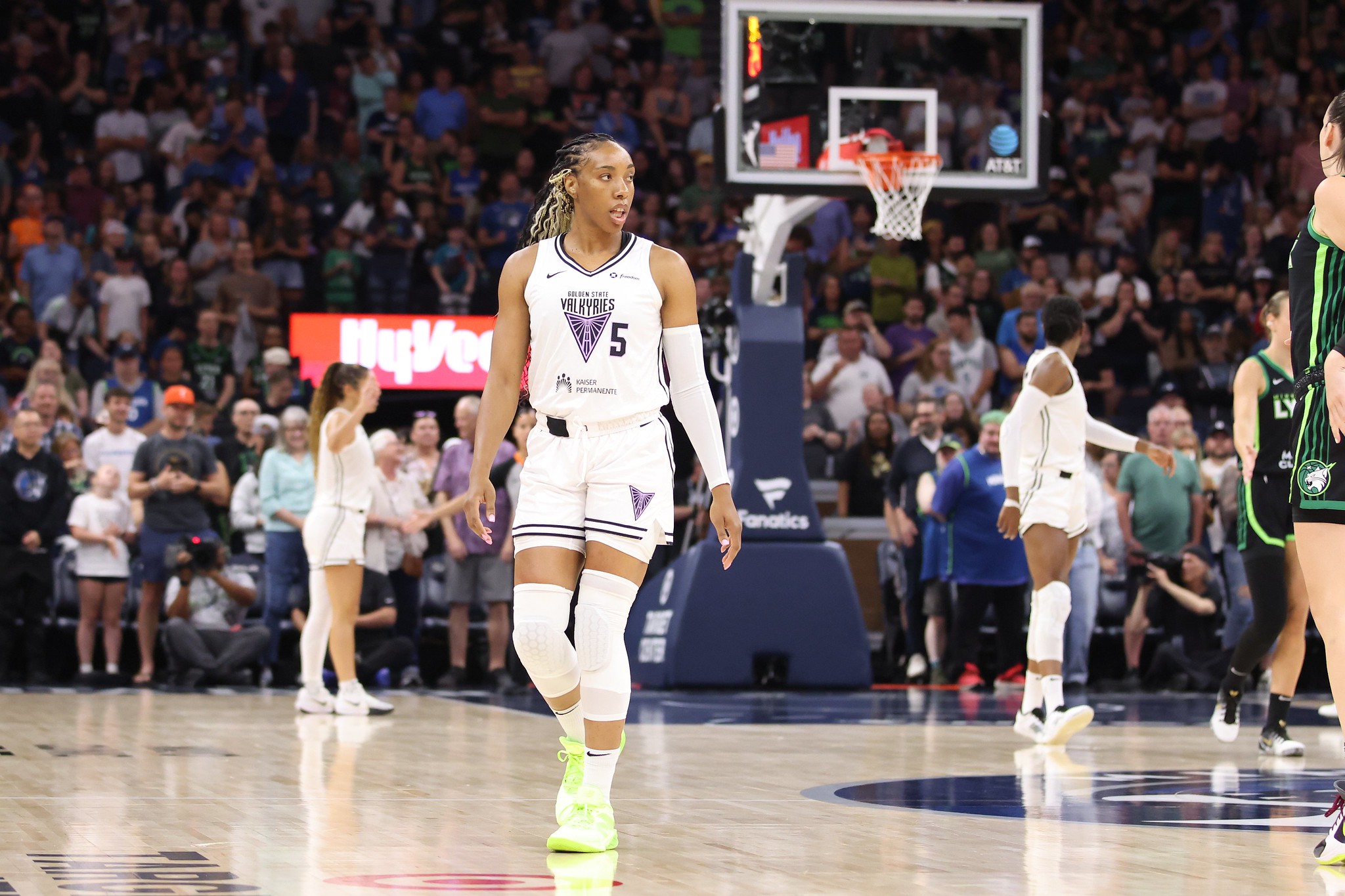 Golden State Valkyries forward Kayla Thornton walks down the court. She is shown from the front with a large but out of focus crowd behind her.