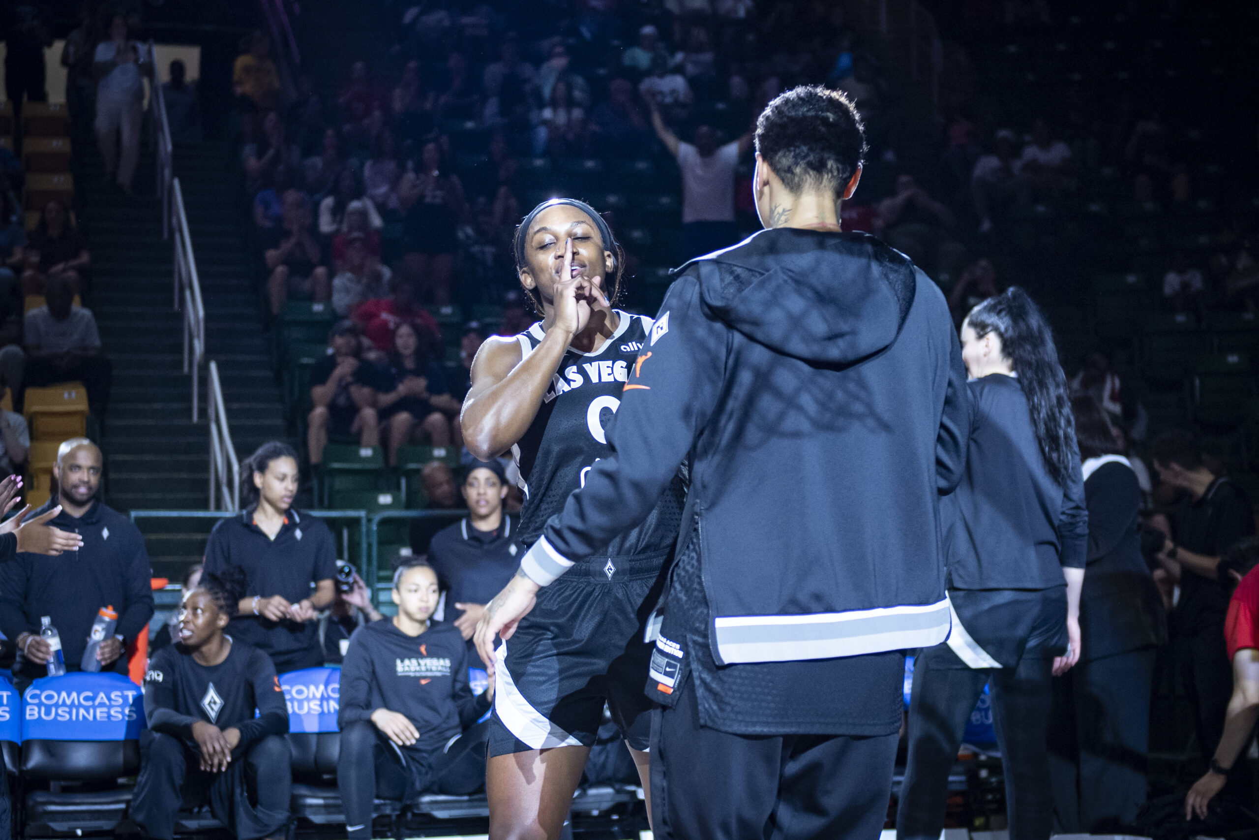 Las Vegas Aces guard Jackie Young does her handshake with forward Kierstan Bell, embracing the “silent assassin” nickname.
