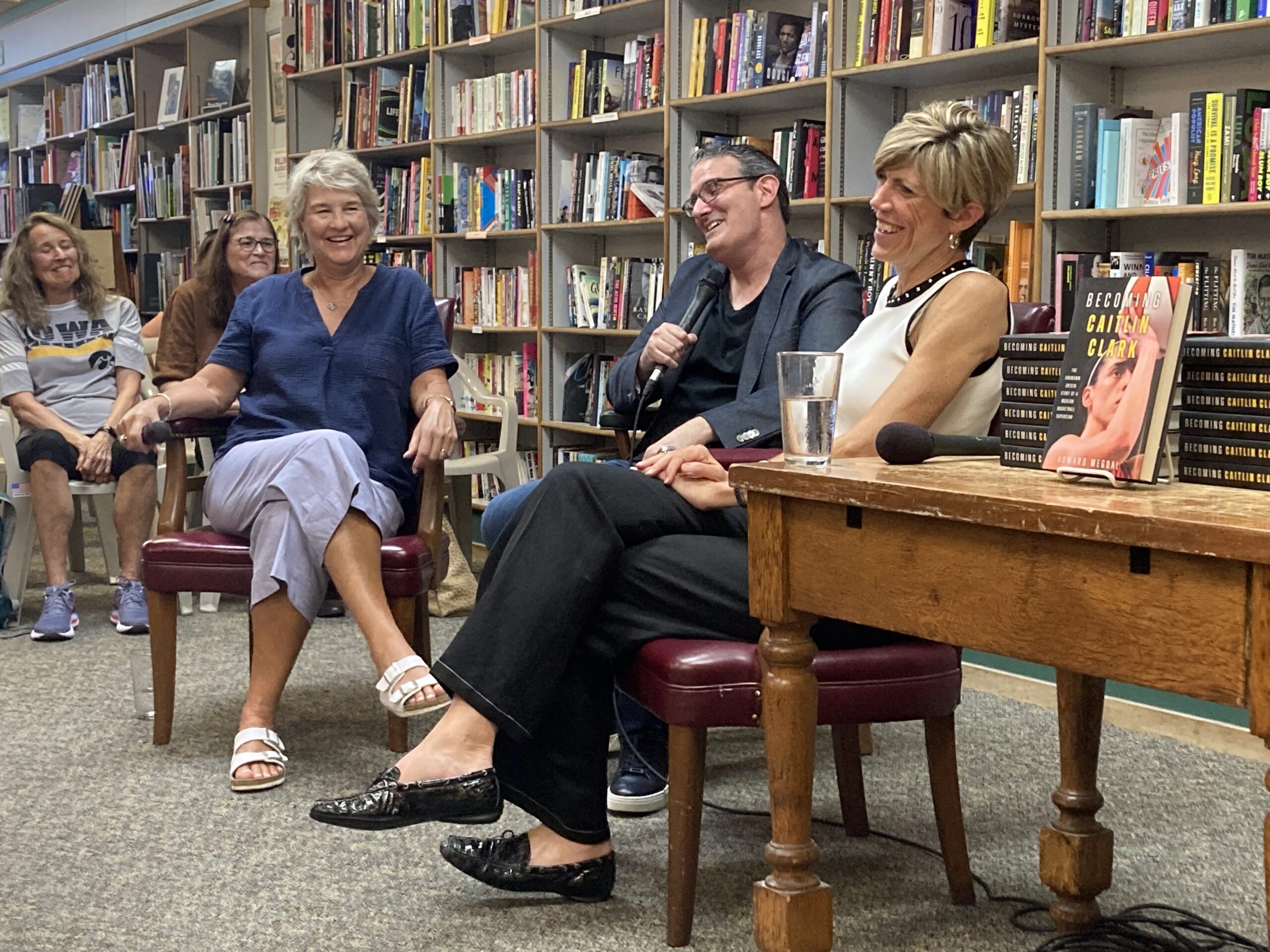 Howard Megdal chats with Lisa Bluder and Jan Jensen at Prairie Lights Bookstore in Iowa City, IA on Friday, July 25. (Jane Burns photo)