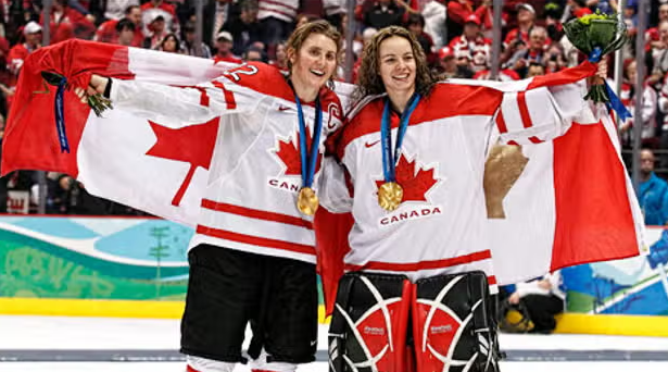 Hayley Wickenheiser and Shannon Szabados celebrate 2010 Gold