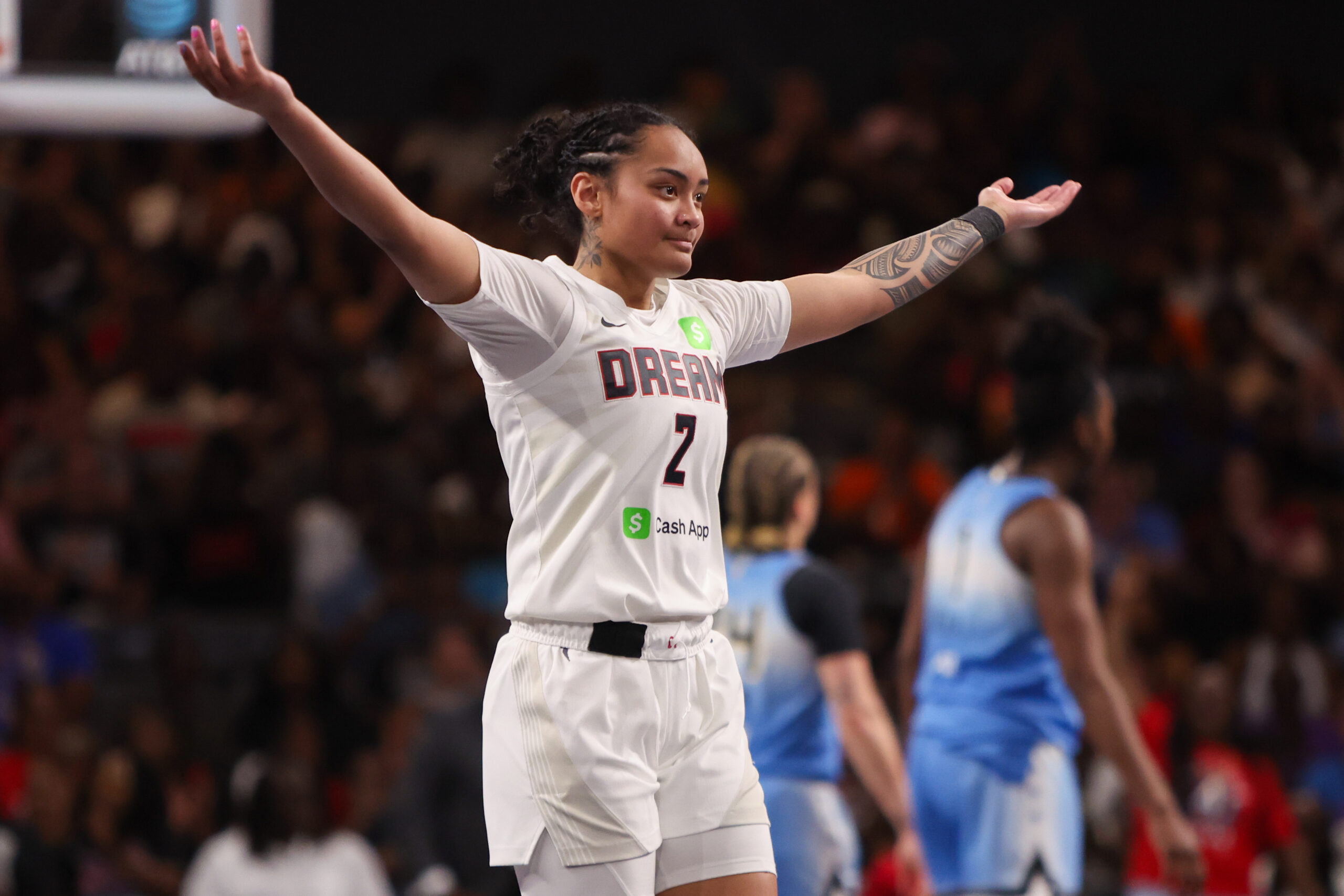 Atlanta Dream guard Te-Hina Paopao (2) looks towards the crowd with her arms outstretched during a game.