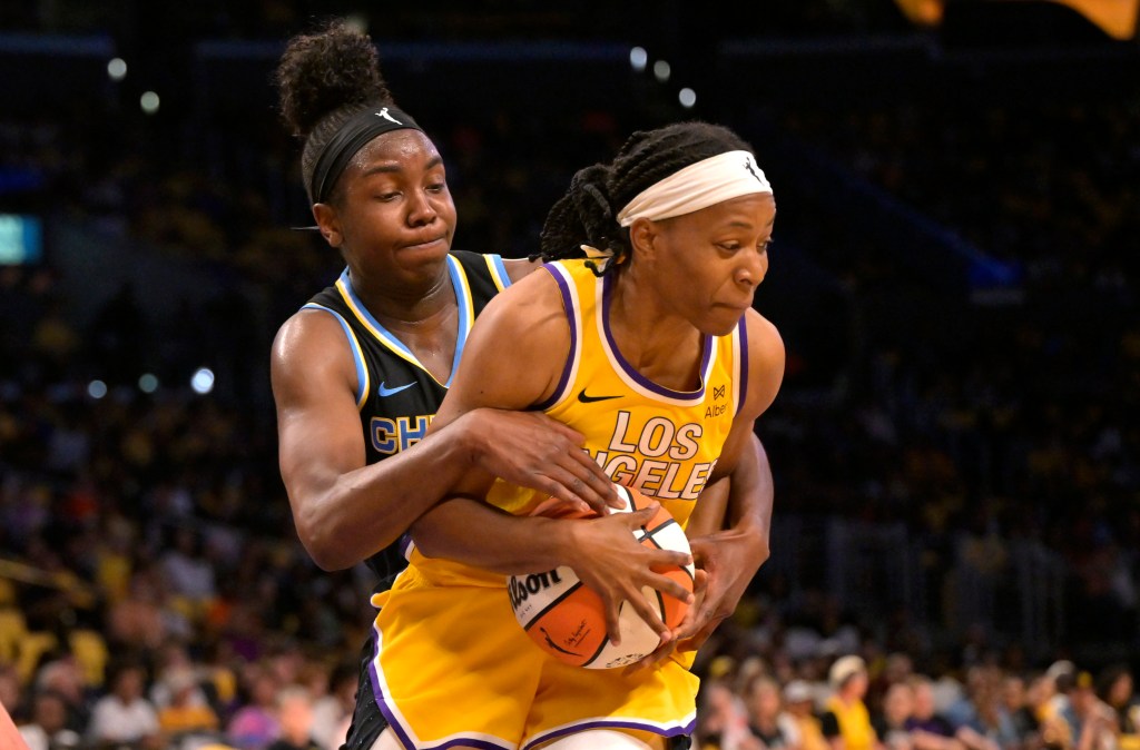 Chicago Sky center Elizabeth Williams (1) and Los Angeles Sparks guard Shey Peddy (7) battle for the ball in the first half at Crypto.com Arena on June 29, 2025.