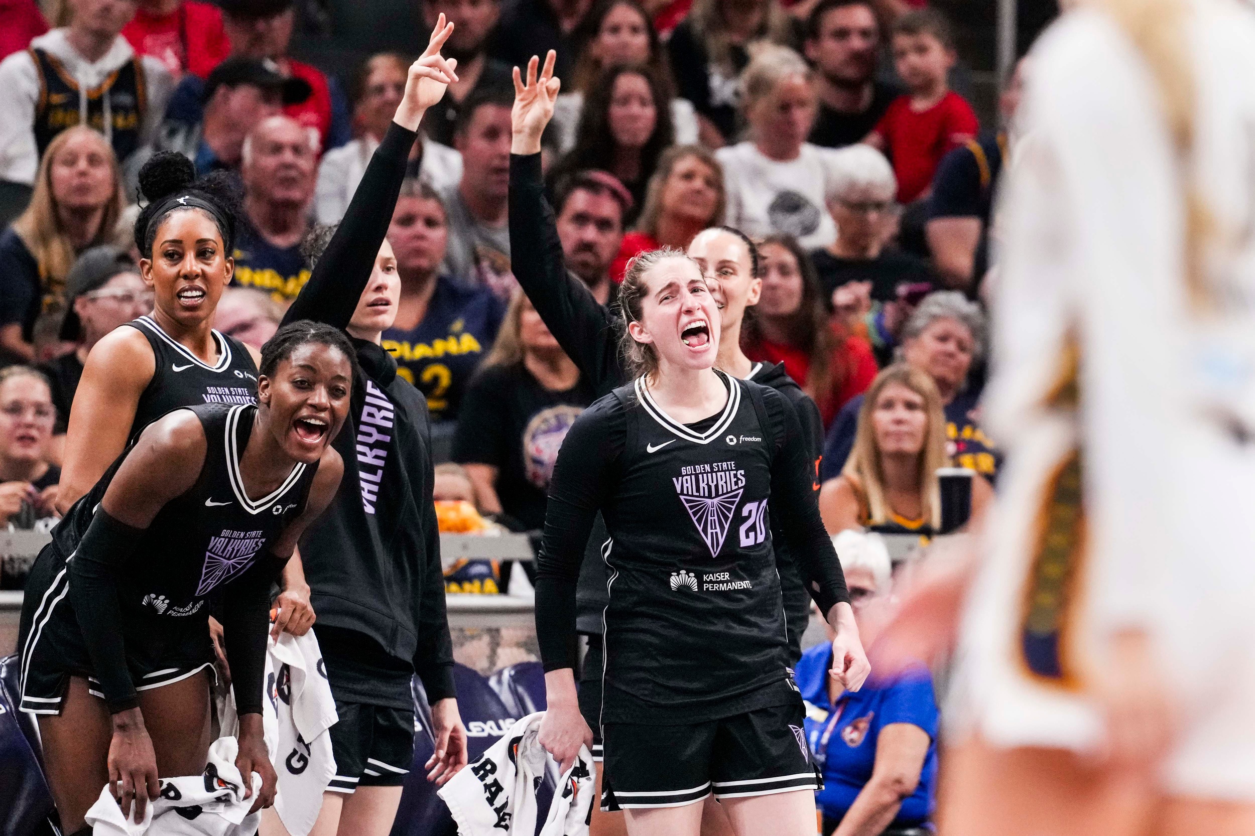 Golden State Valkyries players cheer from the bench in the team's win over Indiana on July 9, 2025.