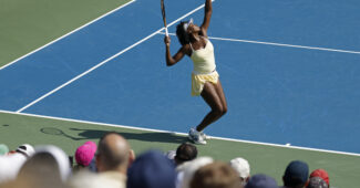 Venus Williams serves in her first round doubles match at the Mubadala Citi DC Open.