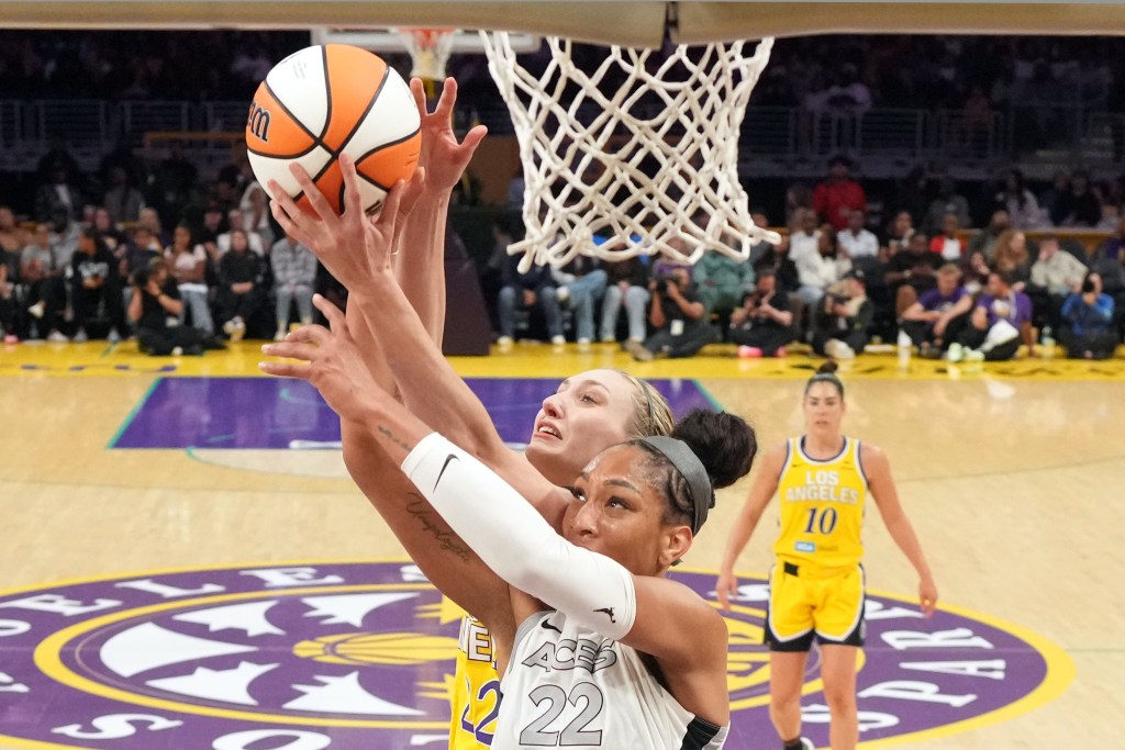 Cameron Brink battles for the basketball at the rim against A'ja Wilson