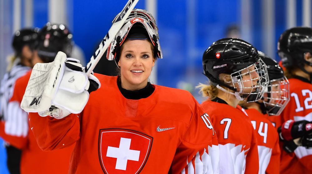 Switzerland's Florence Schelling salutes the crowd wearing a Swiss hockey uniform