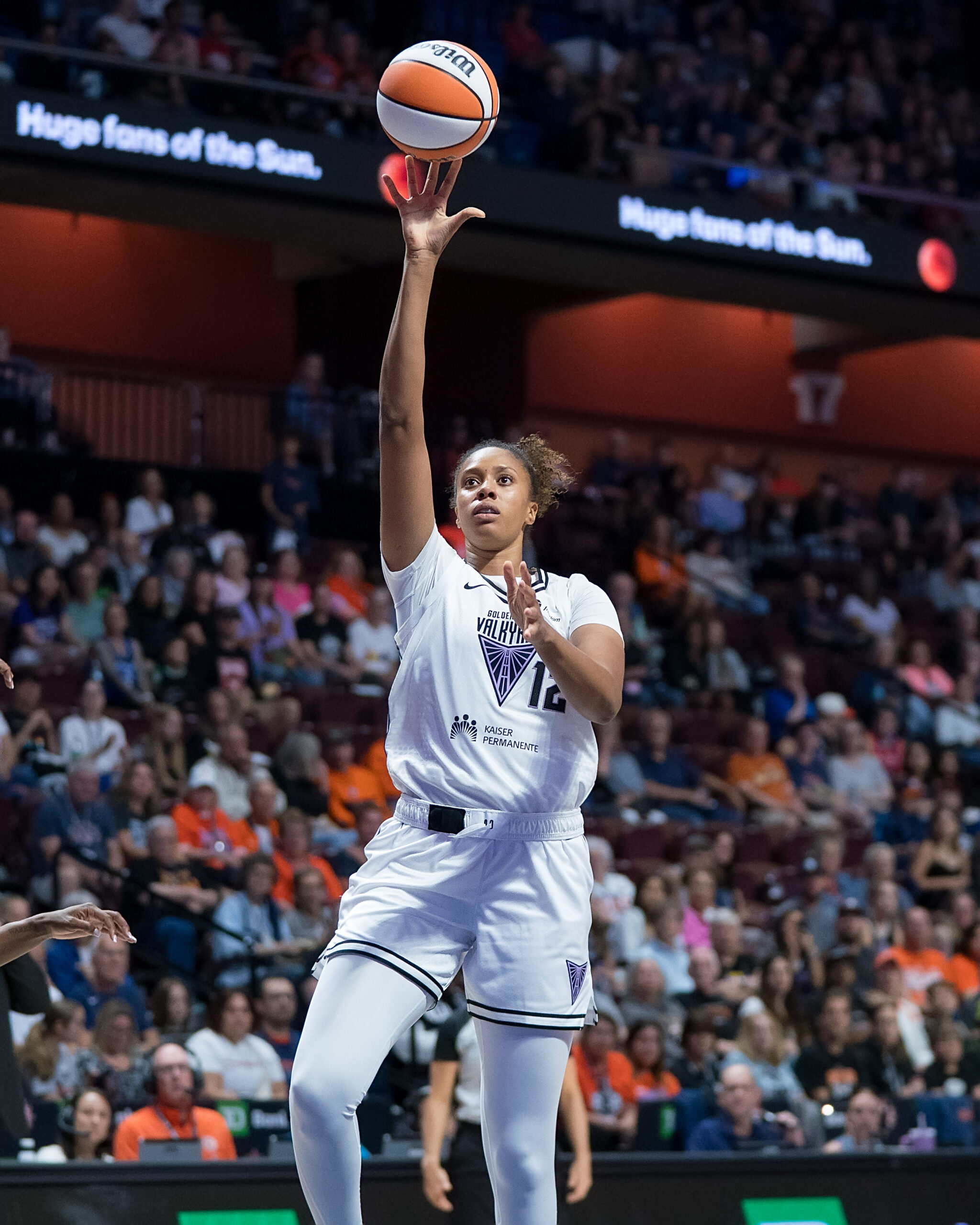Golden State Valkyries center Iliana Rupert shoots a floater. She is shown from the front with a large but out-of-focus crowd behind her.