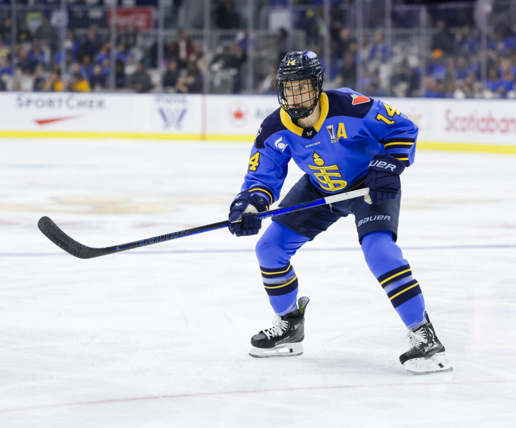 Renata Fast of the Toronto Sceptres mid-play during Game 1 of the 2025 PWHL Playoffs. She's in a blue uniform, holding a hockey stick.