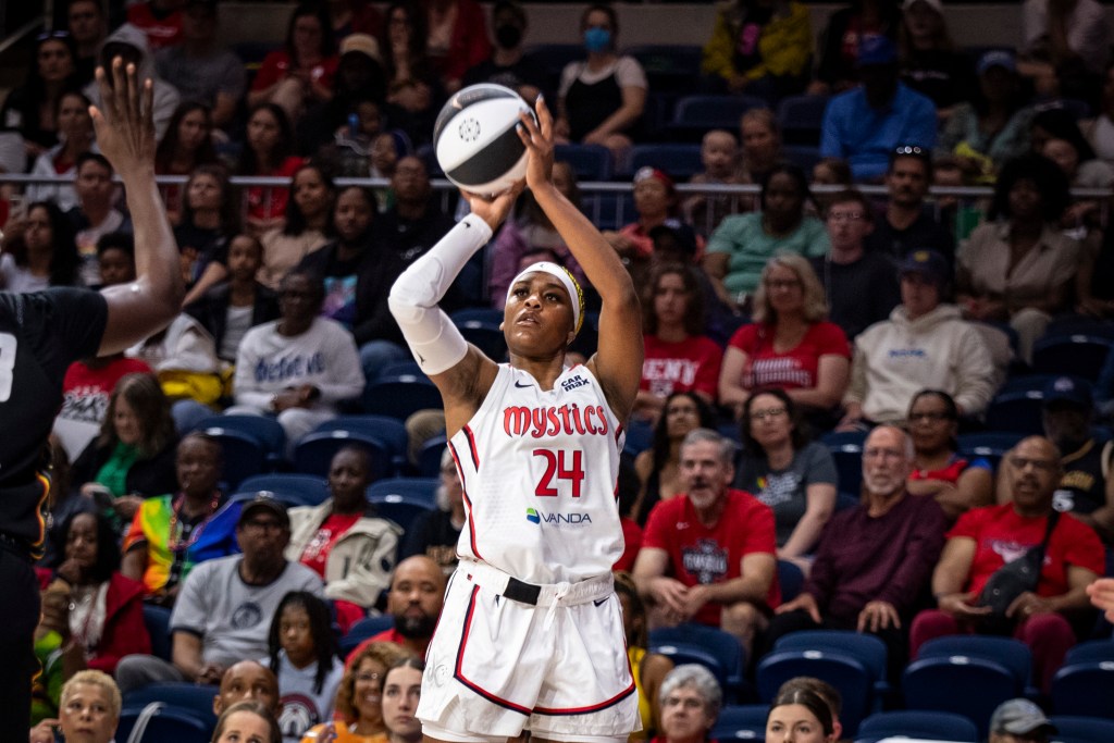 Washington Mystics forward Aaliyah Edwards prepares to release a right-handed jump shot. A Connecticut Sun defender is too far away to contest the shot.