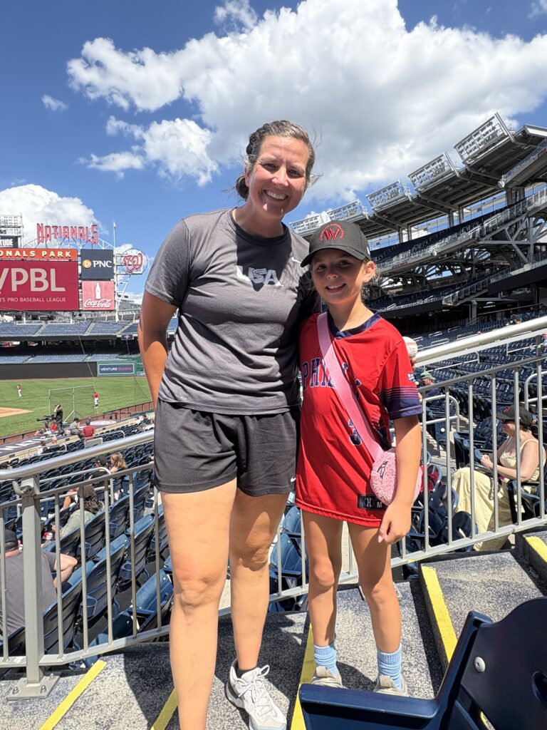 Meggie Meidlinger with youth baseball player and admirer Harper Schatz.