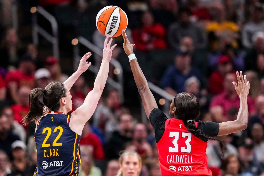 Caldwell closes out on a high-release 3-pointer from Indiana's Caitlin Clark.