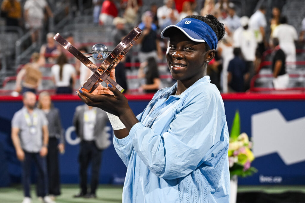 Victoria Mboko holds the National Bank Open's winner's trophy