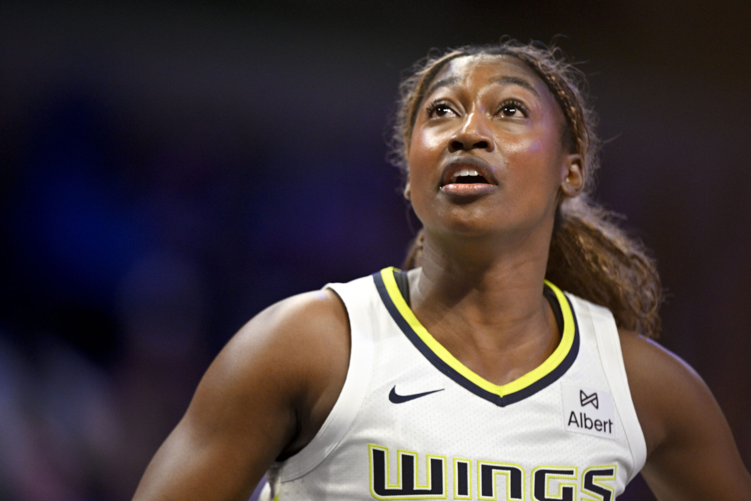 Dallas Wings forward Diamond Miller looks up into the air.