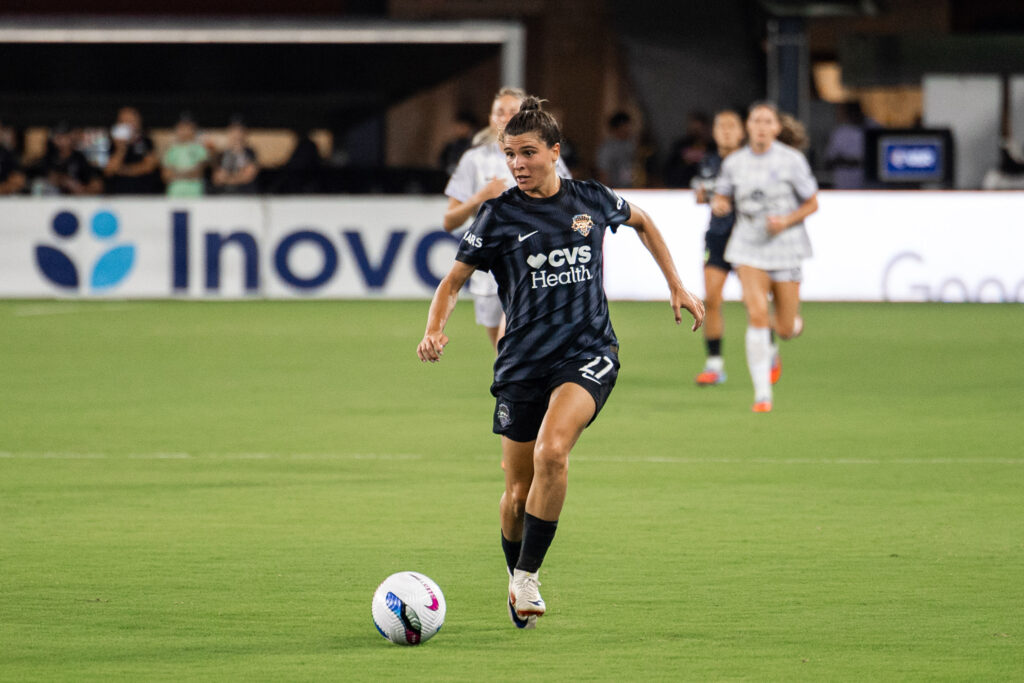 Aug 15, 2025; Washington, District of Columbia, USA; Washington Spirit forward Sofia Cantore (27) dribbles the ball up the field in the first half against Racing Louisville FC at Audi Field. Mandatory Credit: Emily Faith Morgan-Imagn Images