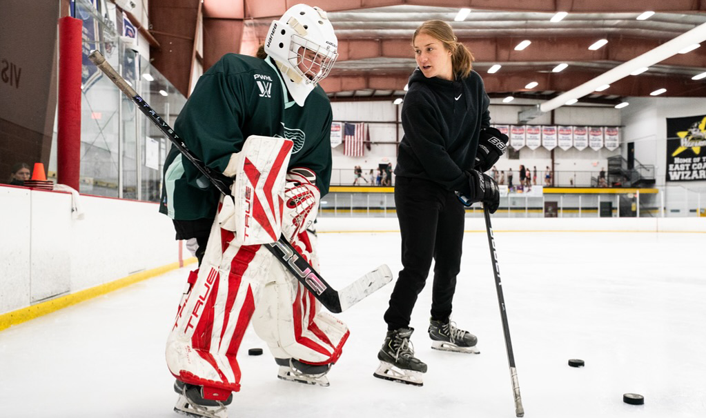Aerin Frankel coaches younger goalie at the Boston Fleet's 2025 Summer Camp