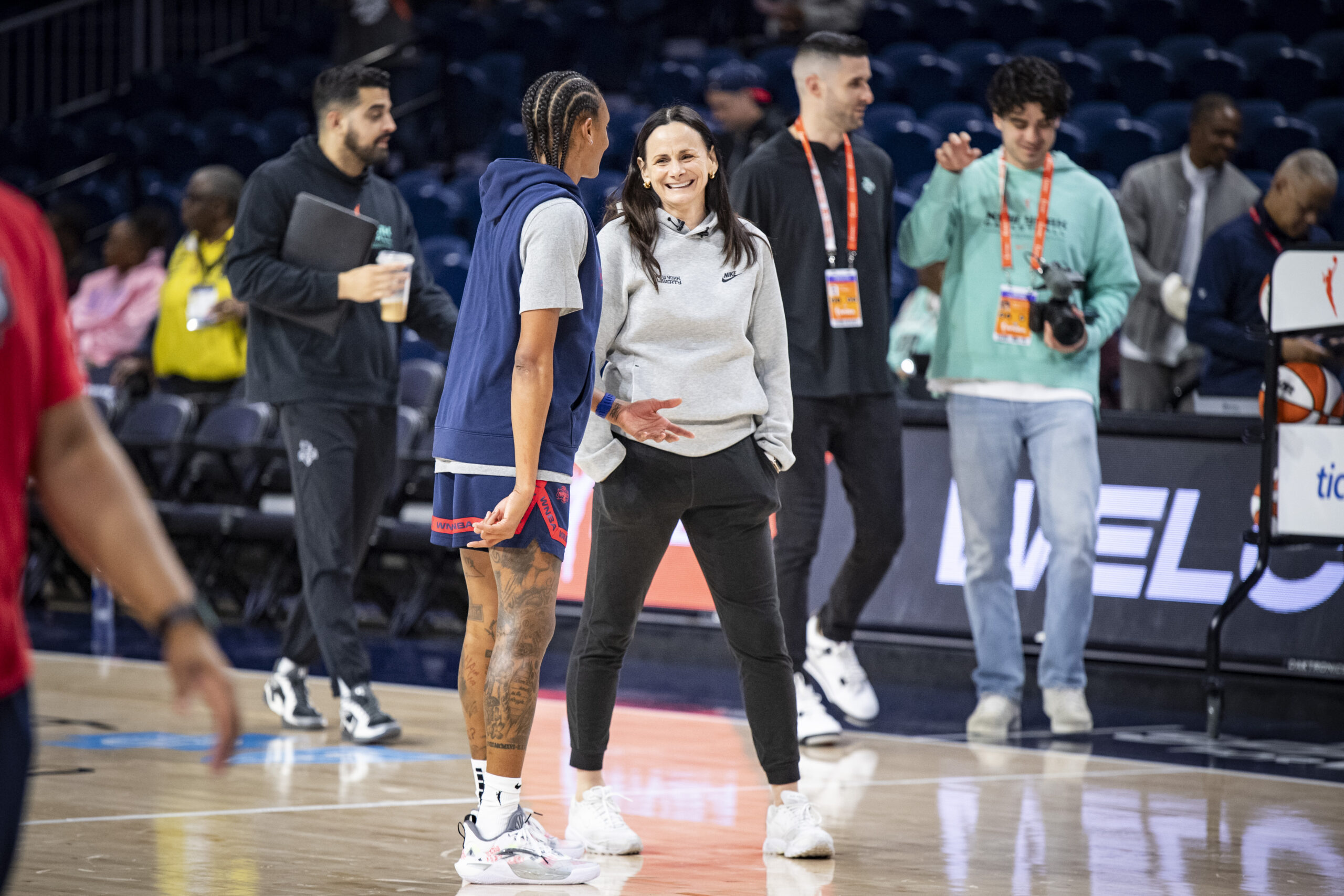 Sandy Brondello smiles with Brittney Sykes before the Liberty played the Mystics.