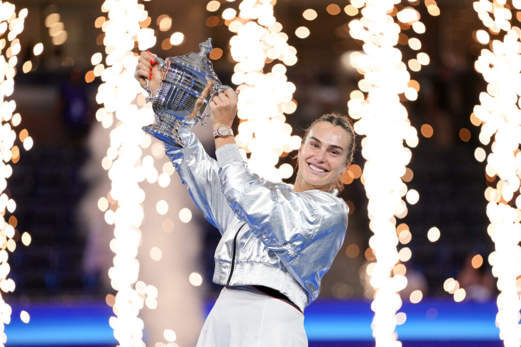 Aryna Sabalenka holds the champion's trophy after winning the 2025 U.S. Open