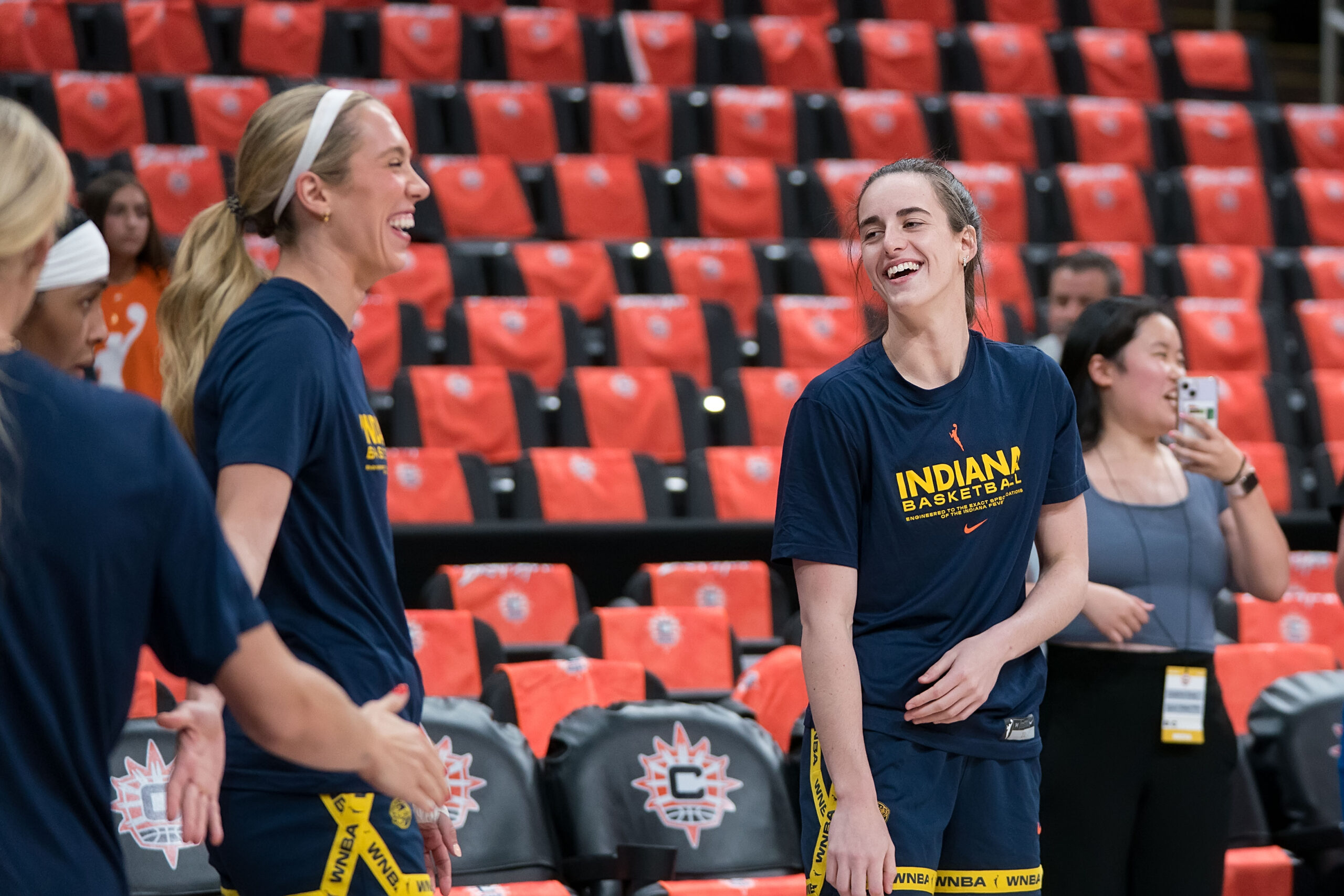 Indiana Fever players Caitlin Clark and Lexie Hull chat while warming up before a game vs Connectiut Sun