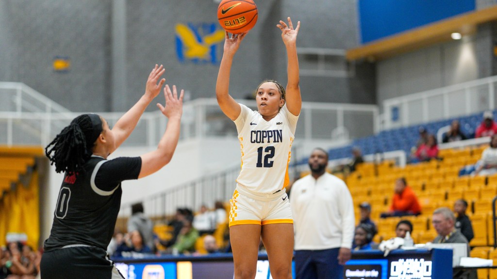Mickelle Lowry shoots as a defender closes in on her in a game.