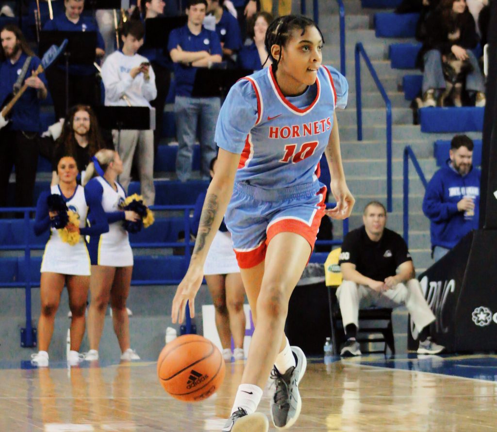 Delaware State's Erika Huggins brings the ball the up the floor and looks for a teammate.
