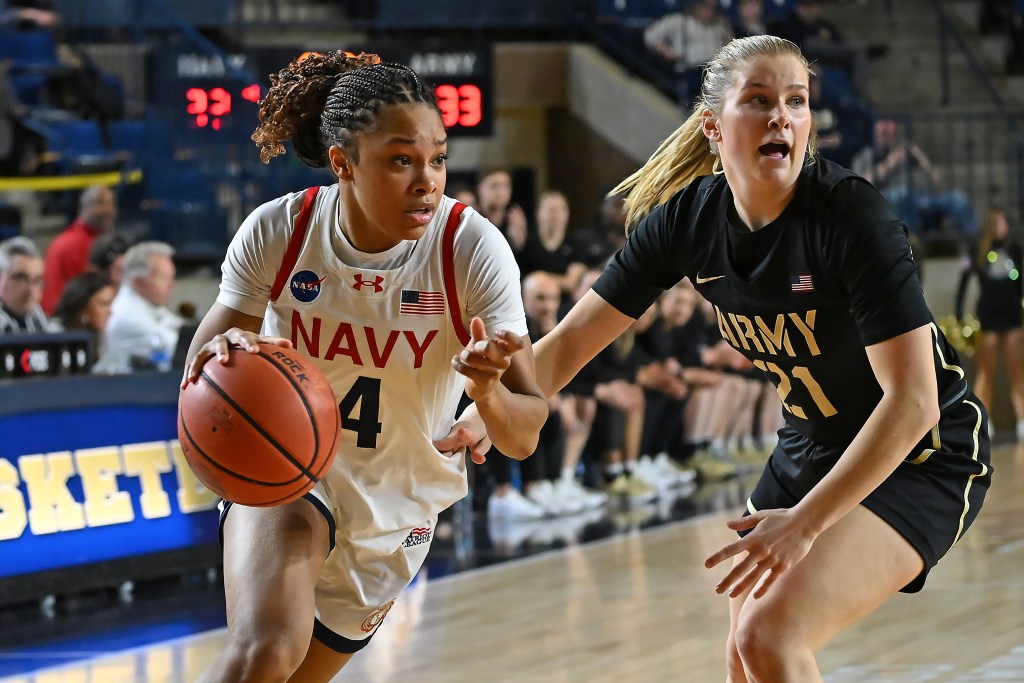 Zanai Barnett-Gay drives to the basket with a right-handed dribble