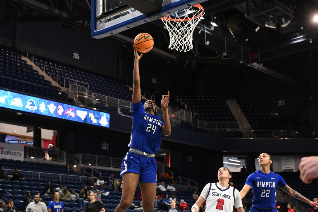 Hampton's Aisha Dabo goes in for a basket against Stony Brook in the CAA tournament.