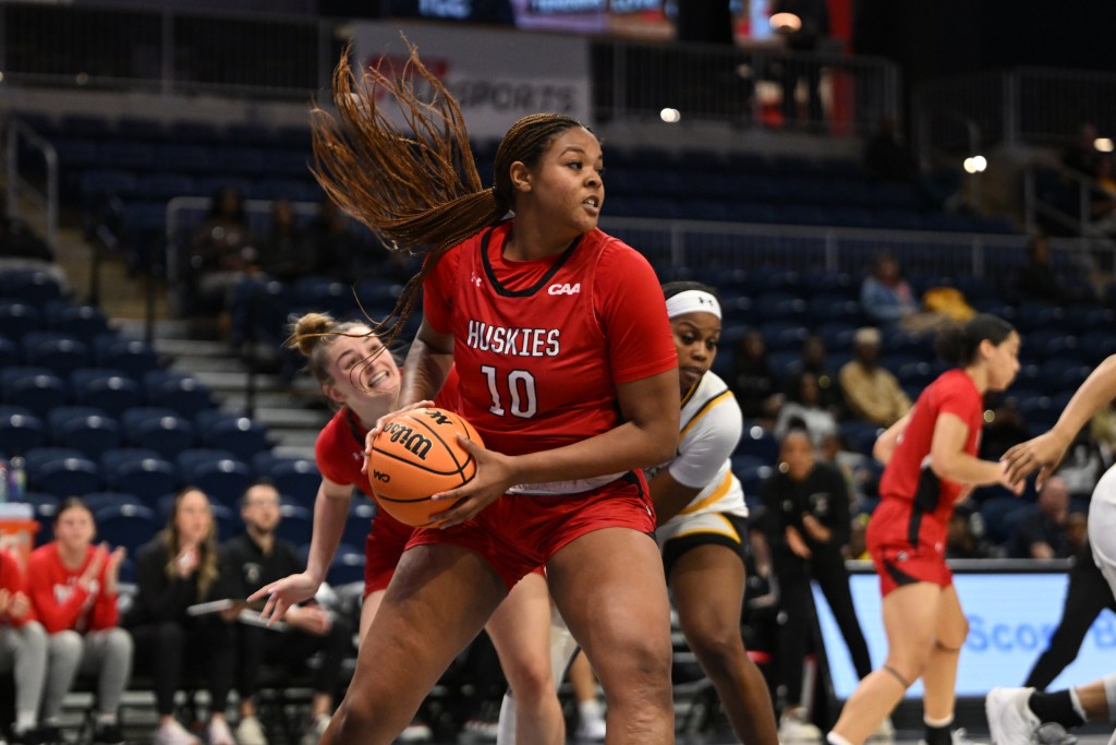 Northeastern's Alyssa Stanton grabs a rebound in a game against Towson during the CAA tournament.