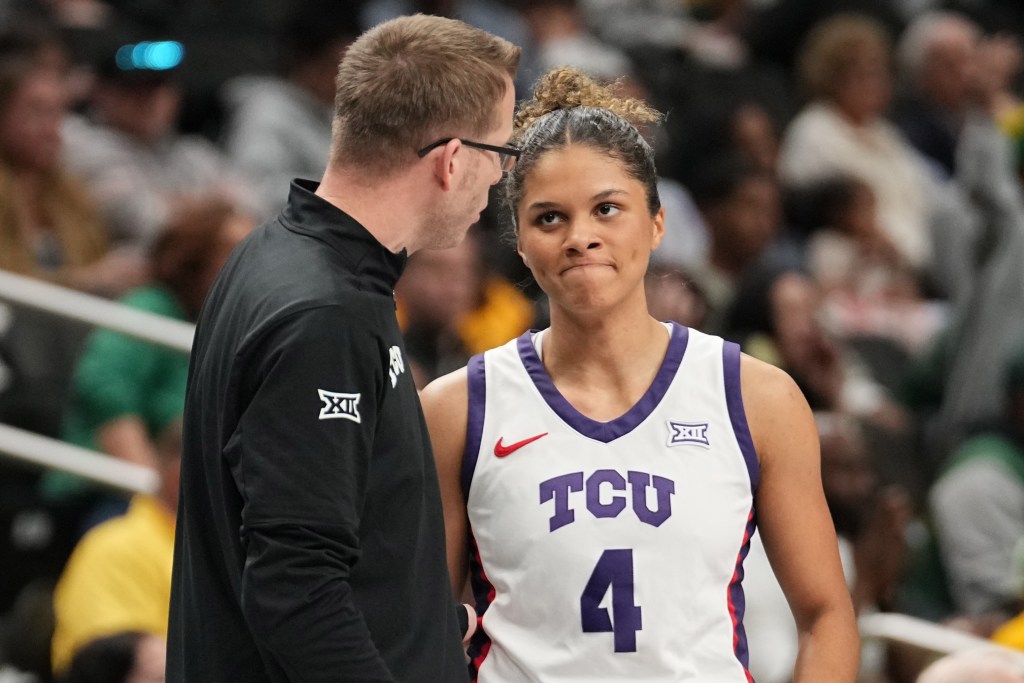 TCU guard Donovyn Hunter grimaces as she talks with head coach Mark Campbell one-on-one.